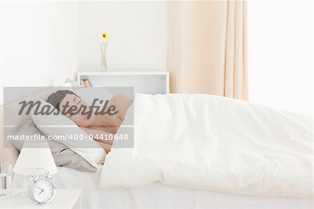 Cute woman sleeping in her bedroom