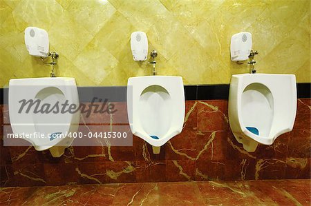 Three Urinals in a row.