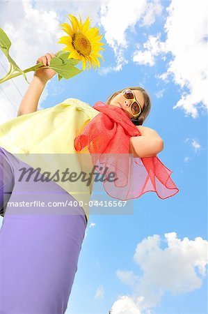 Beauty teen girl and sunflowers