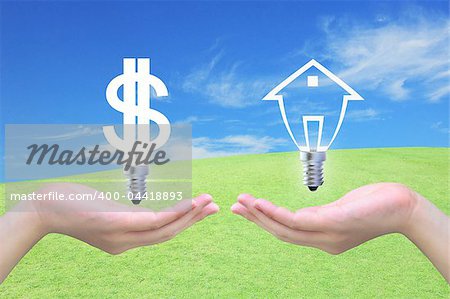 light bulb dollar symbol exchange light bulb model of a house in women hand on sky