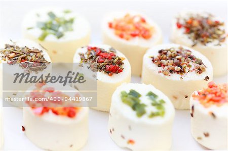 Delicious appetizer - cream cheese with different minced herbs and vegetables