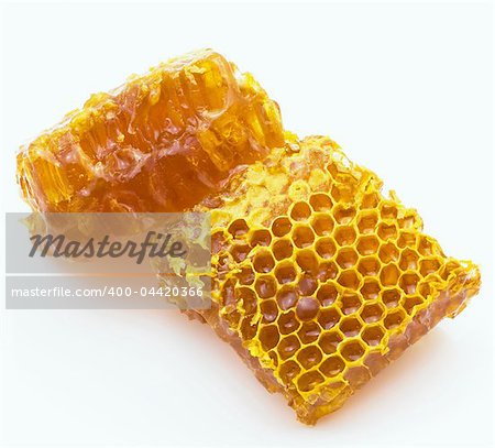 Gold honey honeycombs  isolated on white background