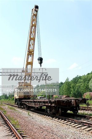 Old Rail Track Mounted Crane with blue sky on background