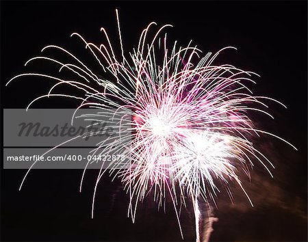 Firework display against black sky