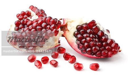 Part of pomegranate and seeds isolated on white background