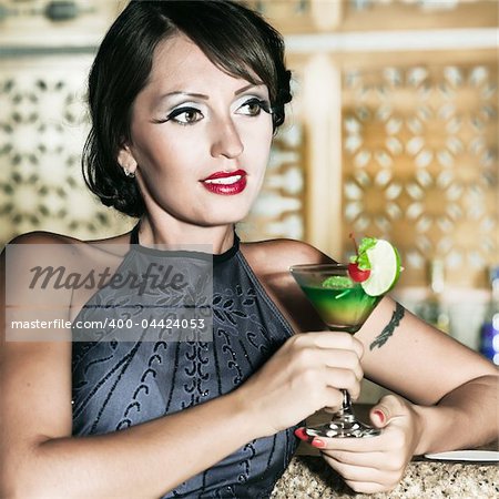 Fashion woman retro portrait with a cocktail