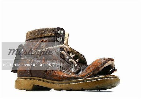 Old and broken shoe. White background