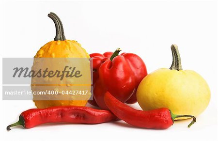 Red and yellow vegetables - little pumpkins, sweet pepper, chili pepper.