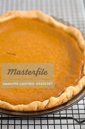 Fresh Baked Pumpkin Pie on a cooling rack