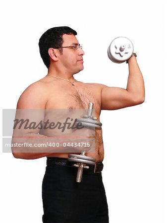 An muscles man is exercising with his dumbbells to stay in shape.