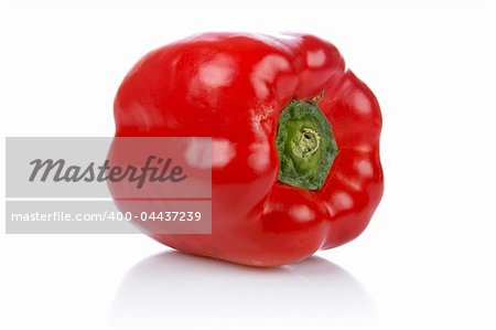A fresh and tasty red pepper reflected on white background. Shallow DOF