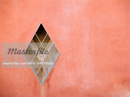 Architectural detail - A window on a red wall