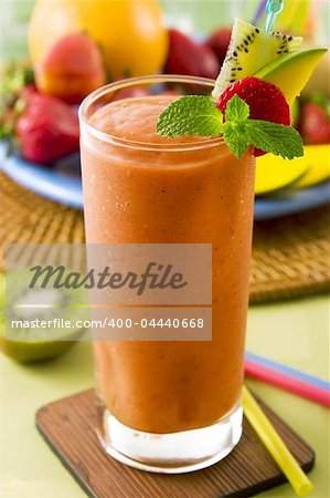 A glass of fruit smoothie (strawberry, mango, kiwi)