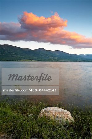 Colorful sunset over the peaceful lake on spring Colorful sunset over the peaceful lake on spring