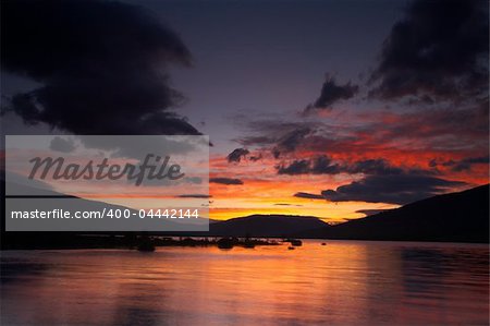 Colorful sunrise over the peaceful lake on spring