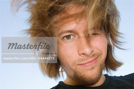 young man smiling (sky background)
