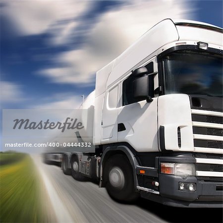 truck driving on country-road/motion blur