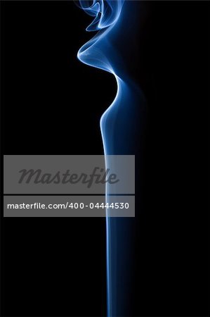 Beautiful patterns in soft, blue smoke as it rises into the air. Isolated on Black.