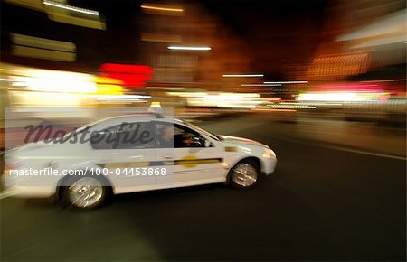 blurred picture of Sydney taxi taking a corner ..