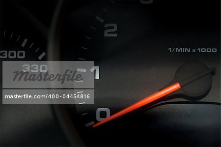 Sportscar dashboard closeup with speedometer