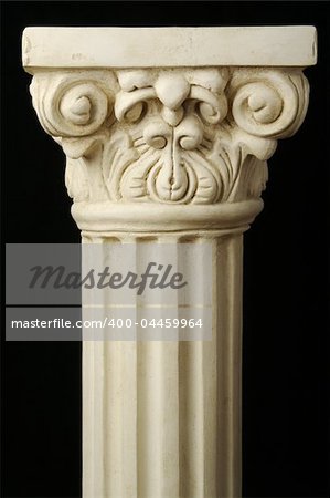 Ancient Column Pillar Replica on a Black Background.