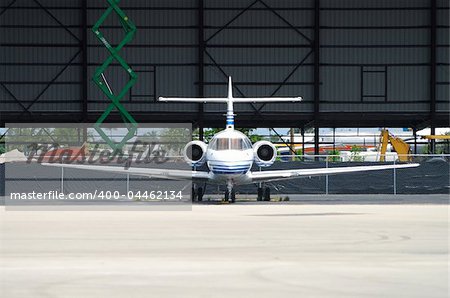 Corporate jet parked in hangar