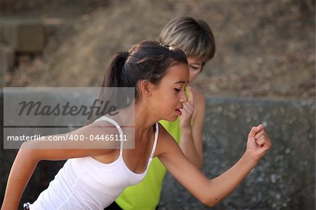 Mother coaching her teenage daughter