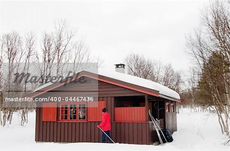 A winter cabin on a snowy landscape