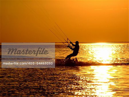 Silhouette of a kitesurf on a gulf on a sunset 2