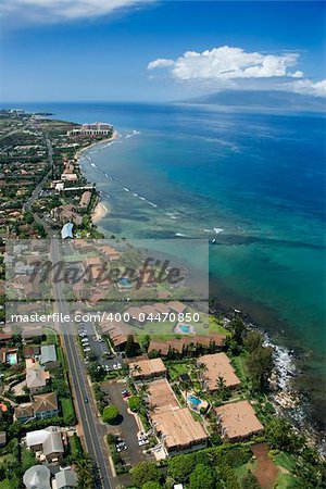 Aerial view of buildings on coastline of Maui, Hawaii.