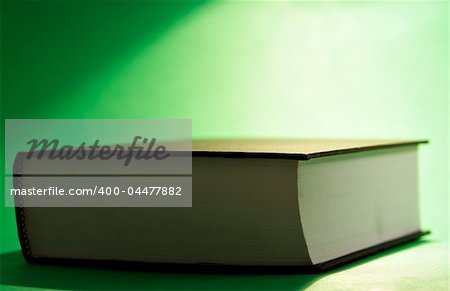 Book on green background