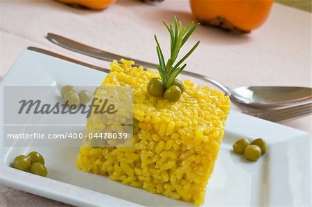 spanish and mediterranean yellow rice style on white platter