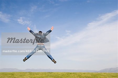 Man jumping on green field