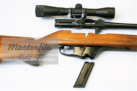 The disassembled rifle with an optical sight