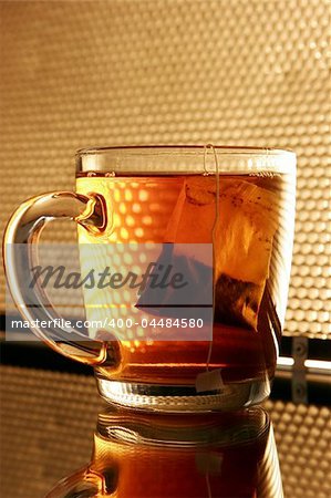 Single glass cup with tea