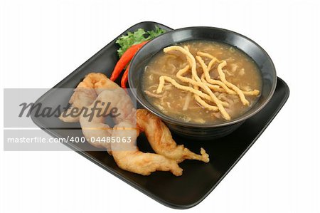 A bowl of Chinese hot & sour soup with crunchy noodles and tempura fried fantail shrimp.  Isolated with clipping path