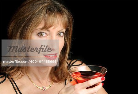 A beautiful, sophisticated woman enjoying a cocktail
