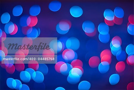 Vivid abstract background - defocused blue and red christmas lights.