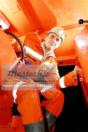 Miner working in a mine shaft stock photo