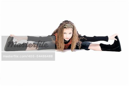Studio portrait of a young girl doing gymnastics