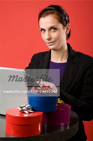 A young female shopping for christmas presents online