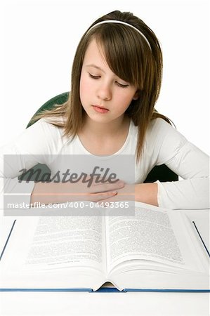 Portrait of Happy young schoolgirl reading book
