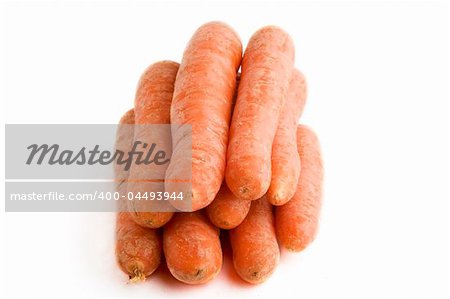 Large group of carrots on a white background