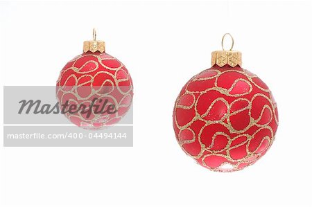 two red ornate colourfull christmas toy balls