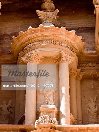Treasury temple entrance facade detail of Nabatean temple or tomb in UNESCO site Petra (Al Khazneh), Jordan. Siq canyon.