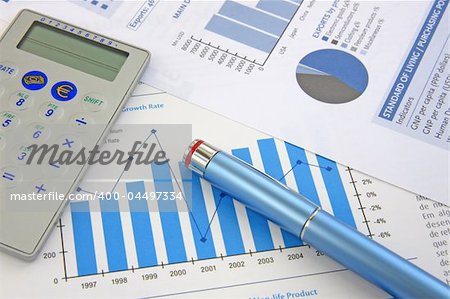 Business Background: Financial report, pen and Calculator