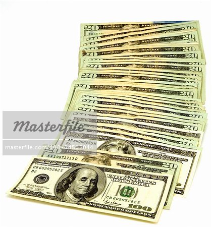 A stack of American 100 and 20 dollar bills isolated on white background.