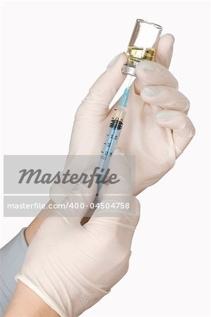 Syringe and vail in hand on white background