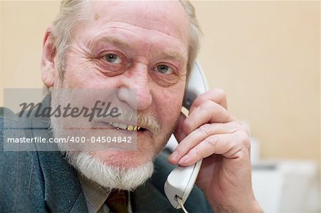 Mature businessman talking on the phone,