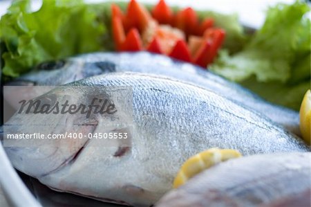 fresh bass with vegetables, ready to cook